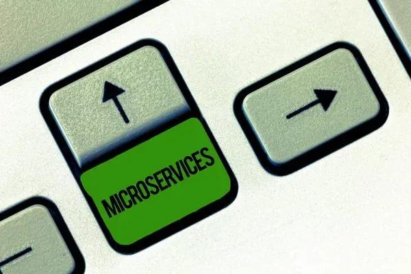 Keyboard keys including a green key labeled Microservices