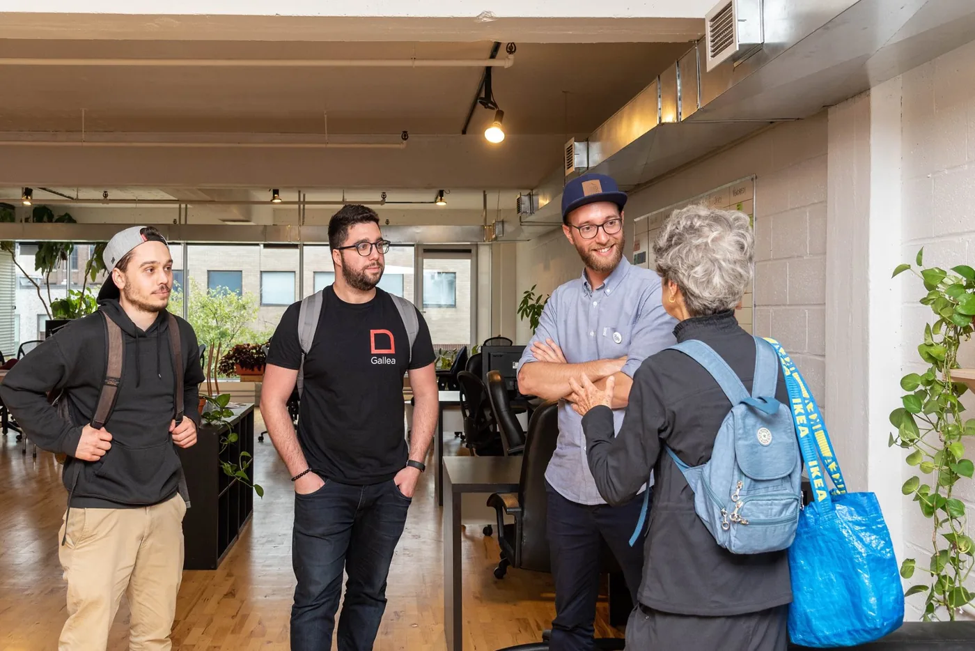 Visitors talking with team members in the TRACTR offices