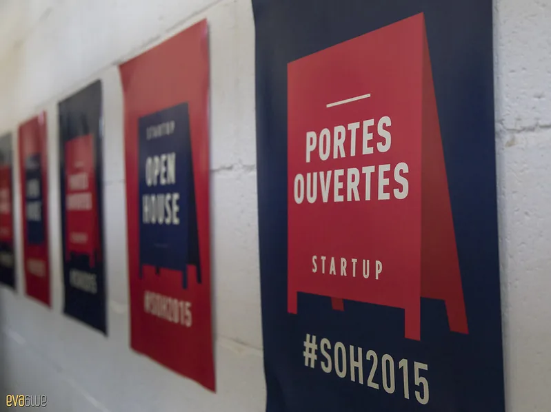 Startup Open House 2015 open doors posters on a wall